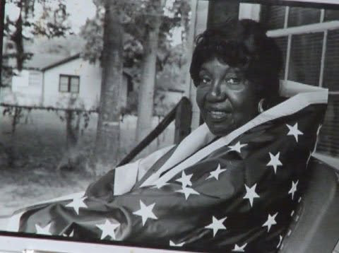 Rosalie Frazier Pazant, educator and community leader, draped in an American flag